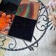 Small coffee table from the 1950s in wrought iron and glazed ceramic.