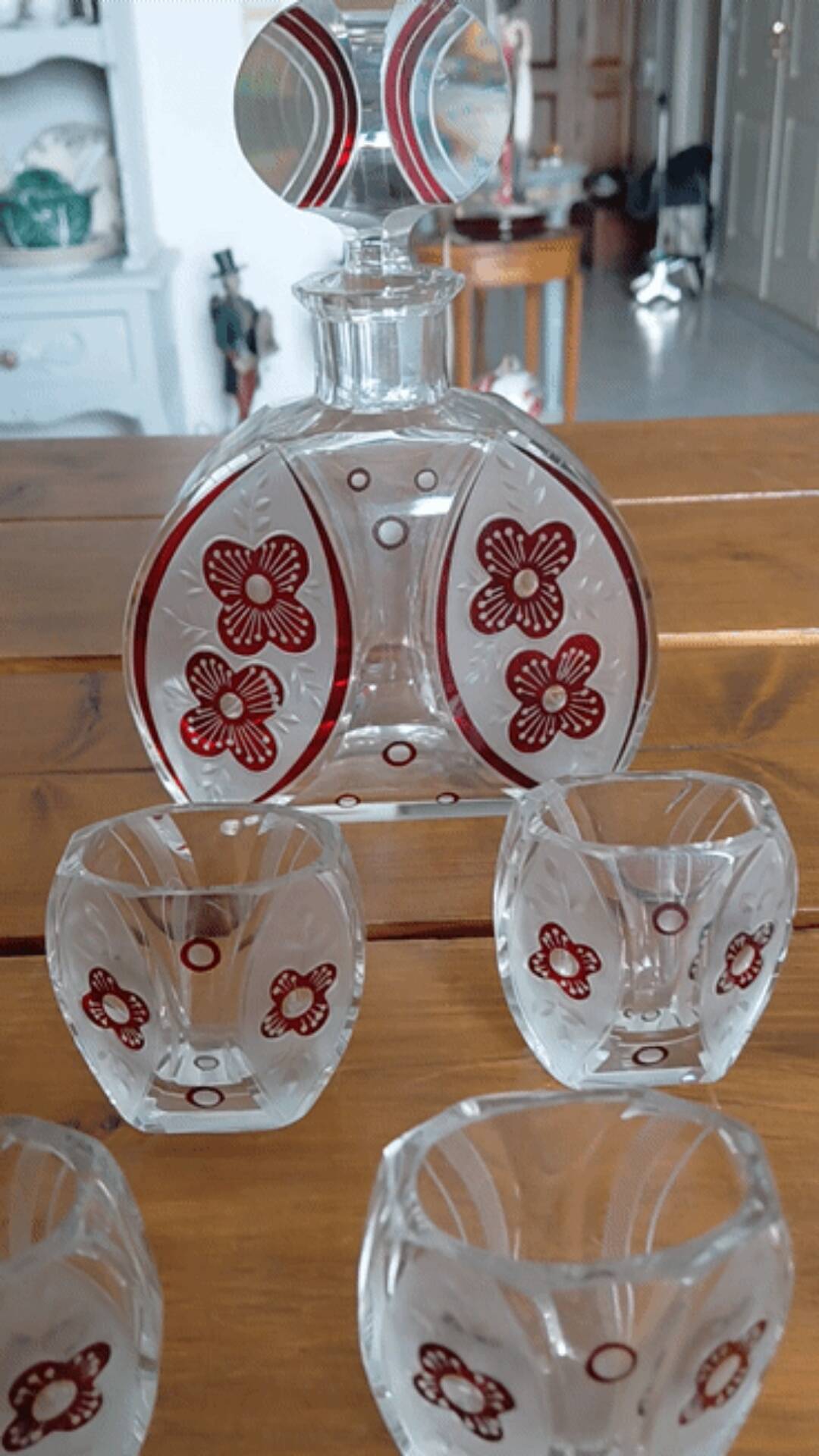 Vintage liqueur service in decorated red glass – decanter and 7 glasses