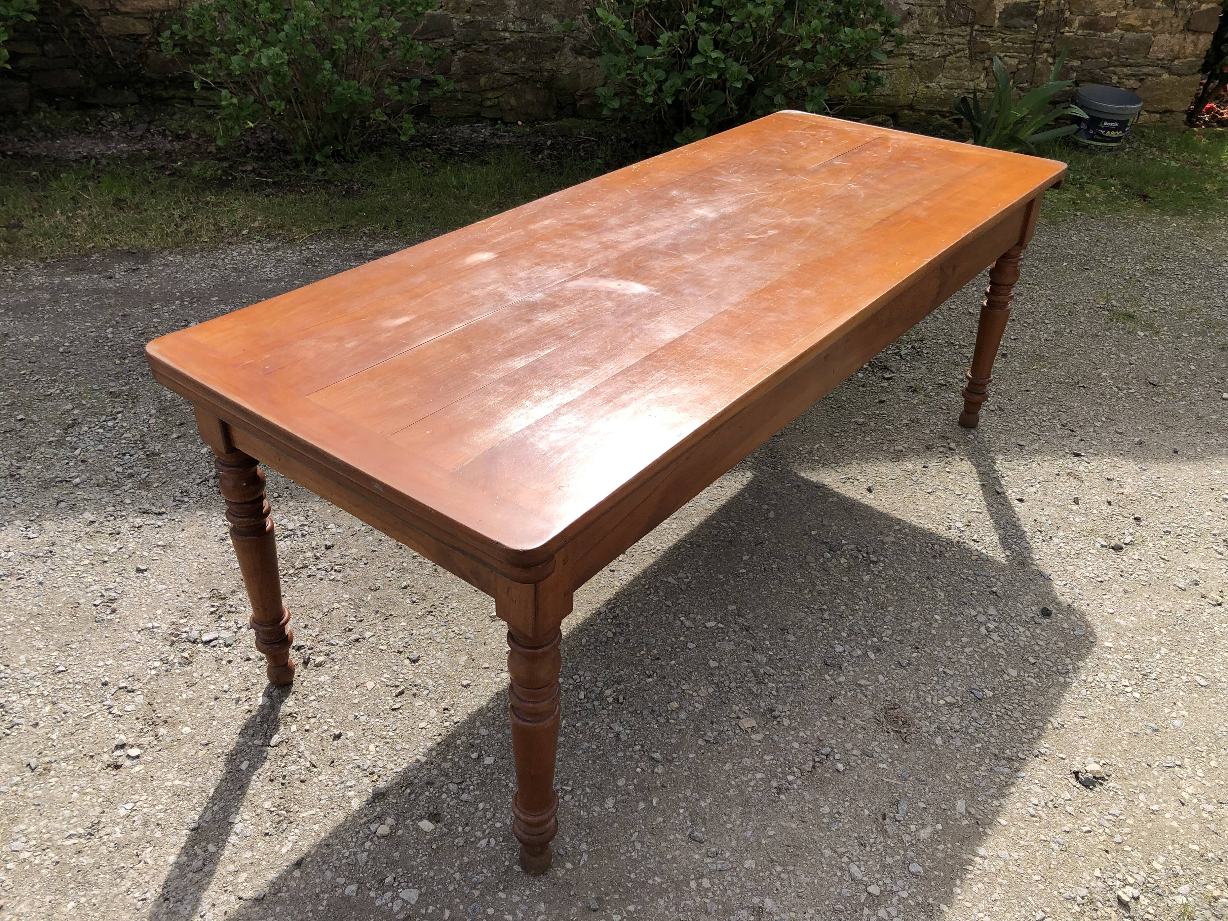 Antique Louis Philippe style farmhouse table in solid cherry wood with its 2 extensions.