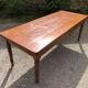 Antique Louis Philippe style farmhouse table in solid cherry wood with its 2 extensions.