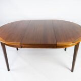 Dining table in rosewood with two extension plates, of danish design from the 1960s.