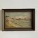 Oil on canvas depicting a rocky coast from the early 20th century