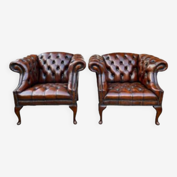Pair of leather Chesterfield armchairs