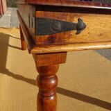 Solid wood and wrought iron table