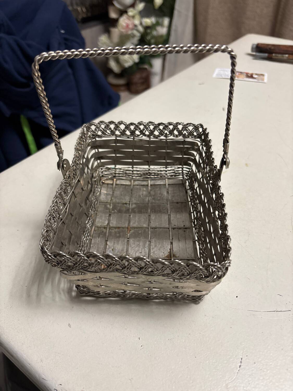 Antique woven metal basket