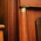 Mahogany pediment and half-column mirror and 118x91cm Empire-style bronze ornament