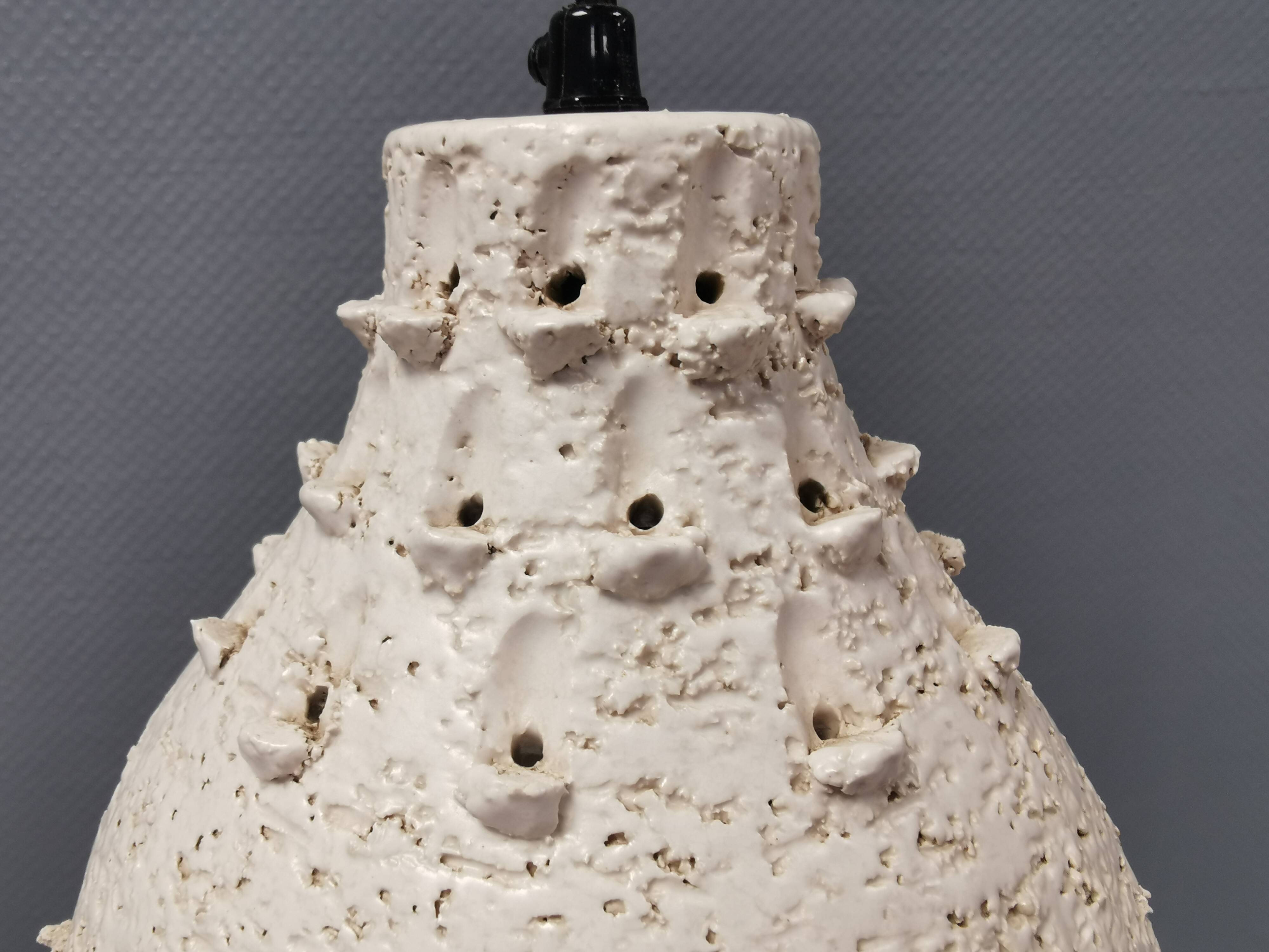 Two ceramic hanging lamps, in creamy white color, looking almost like coral