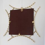 Miroir en fer forgé doré