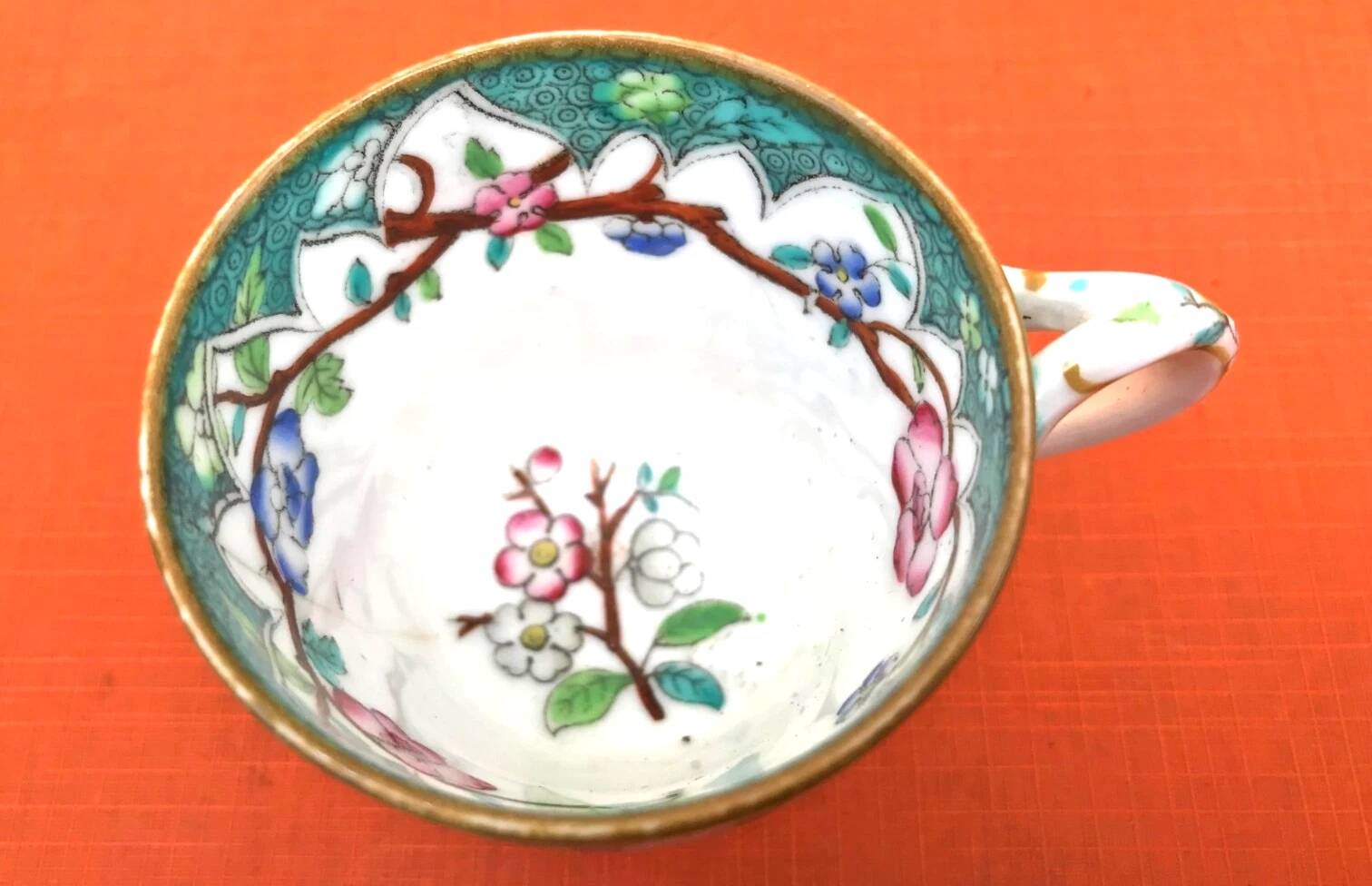 Antique porcelain cup in the Minton style with Japanese decoration.