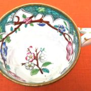 Antique porcelain cup in the Minton style with Japanese decoration.