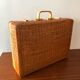 Vintage braided wicker suitcase