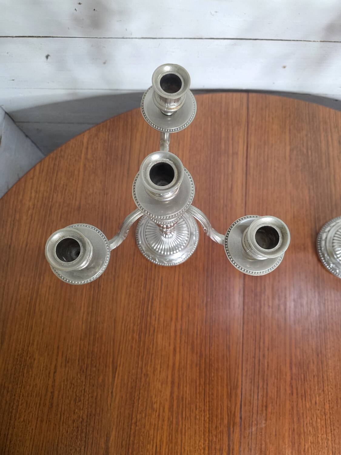 Pair of Louis XVI style candlesticks in silver-plated bronze