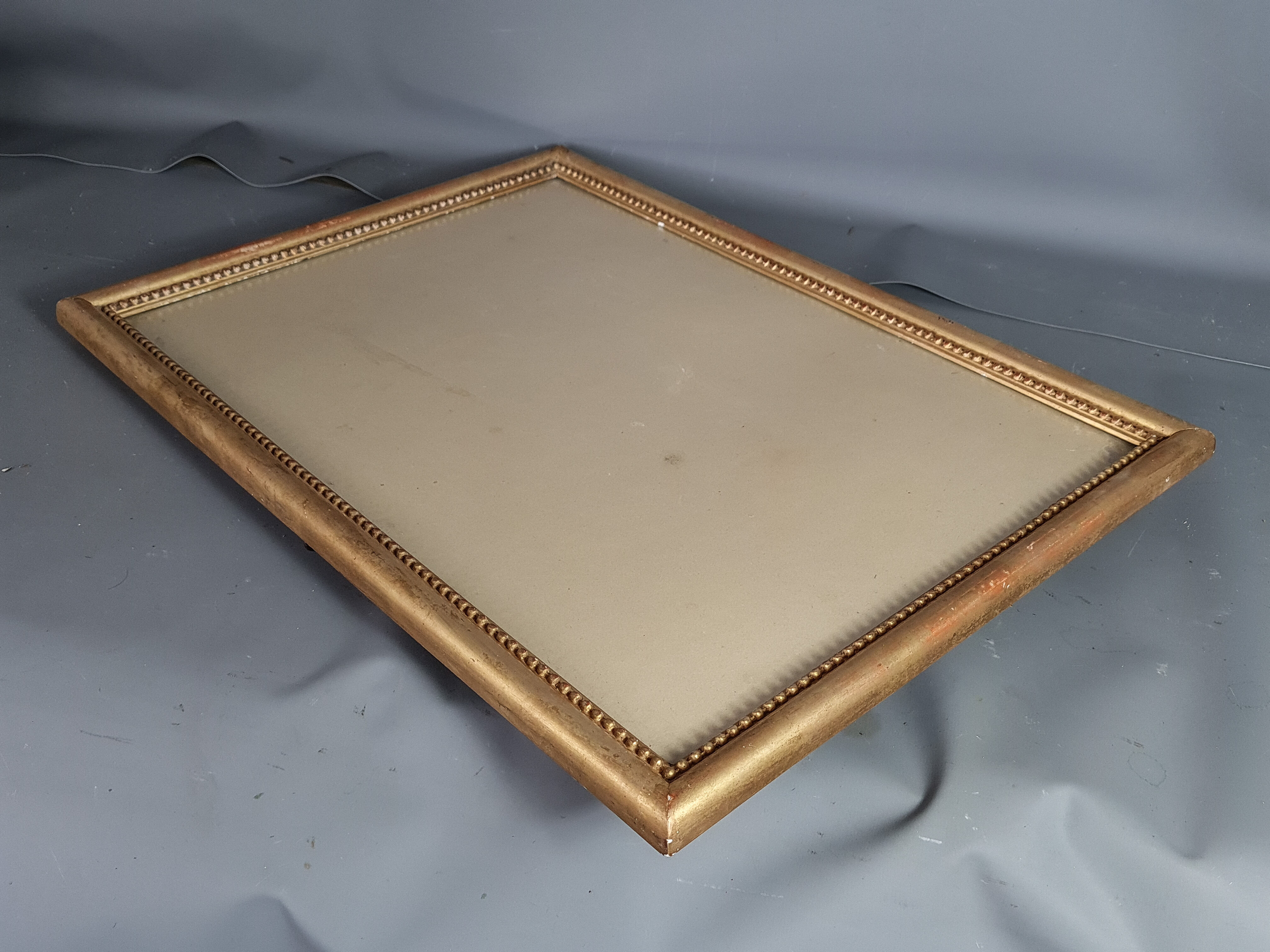 Old frame beaded decoration, gilded stucco wood