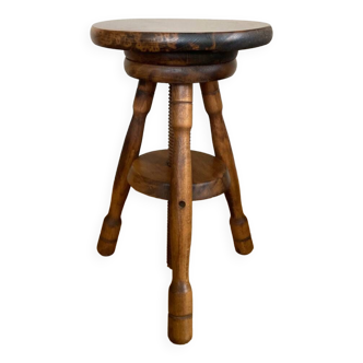 Wooden stool with central grip, quadripod base, 20th century