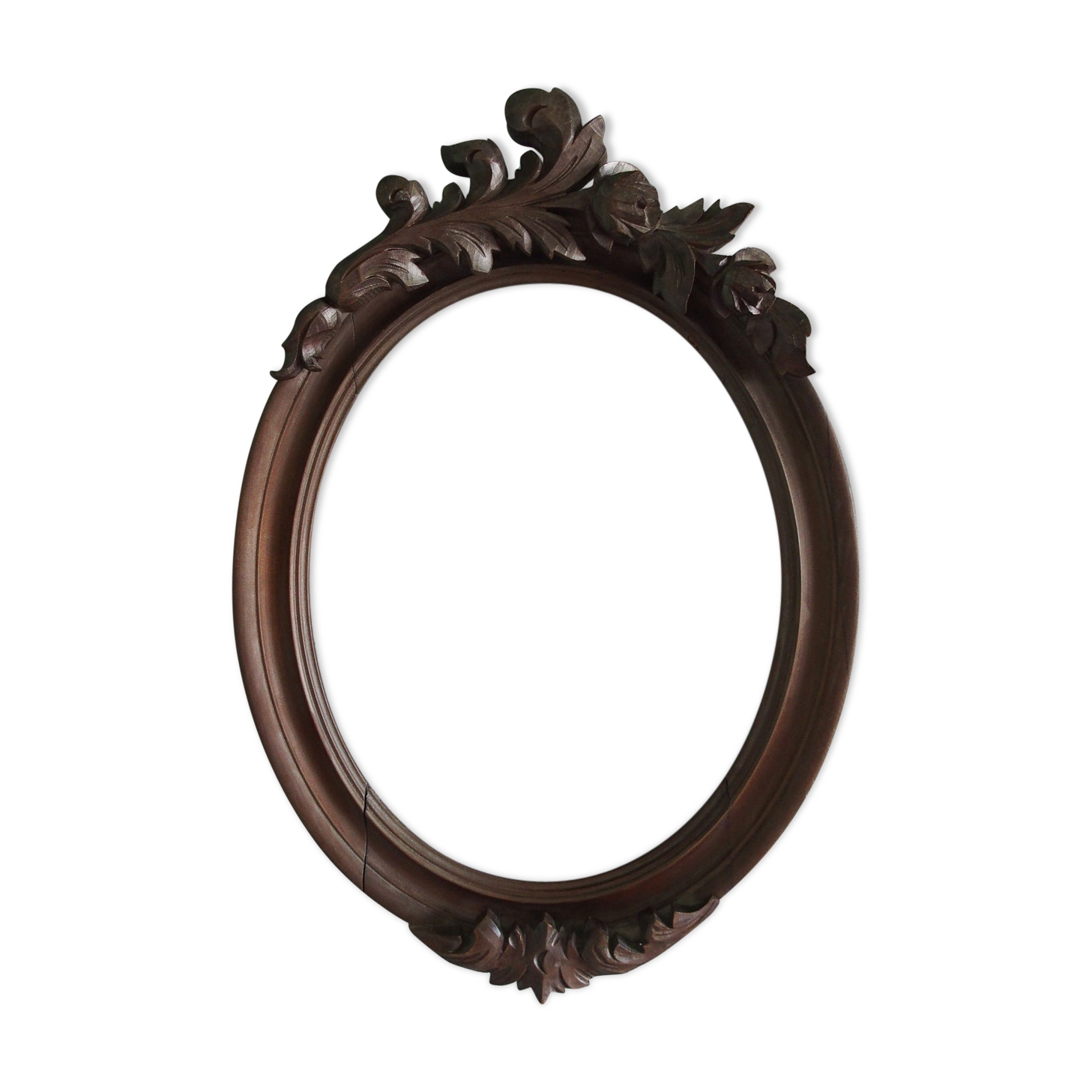 Wooden oval frame with carved pediment