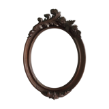 Wooden oval frame with carved pediment