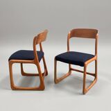 Pair of vintage Baumann sled chairs with curved wood in honey colour.