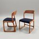 Pair of vintage Baumann sled chairs with curved wood in honey colour.