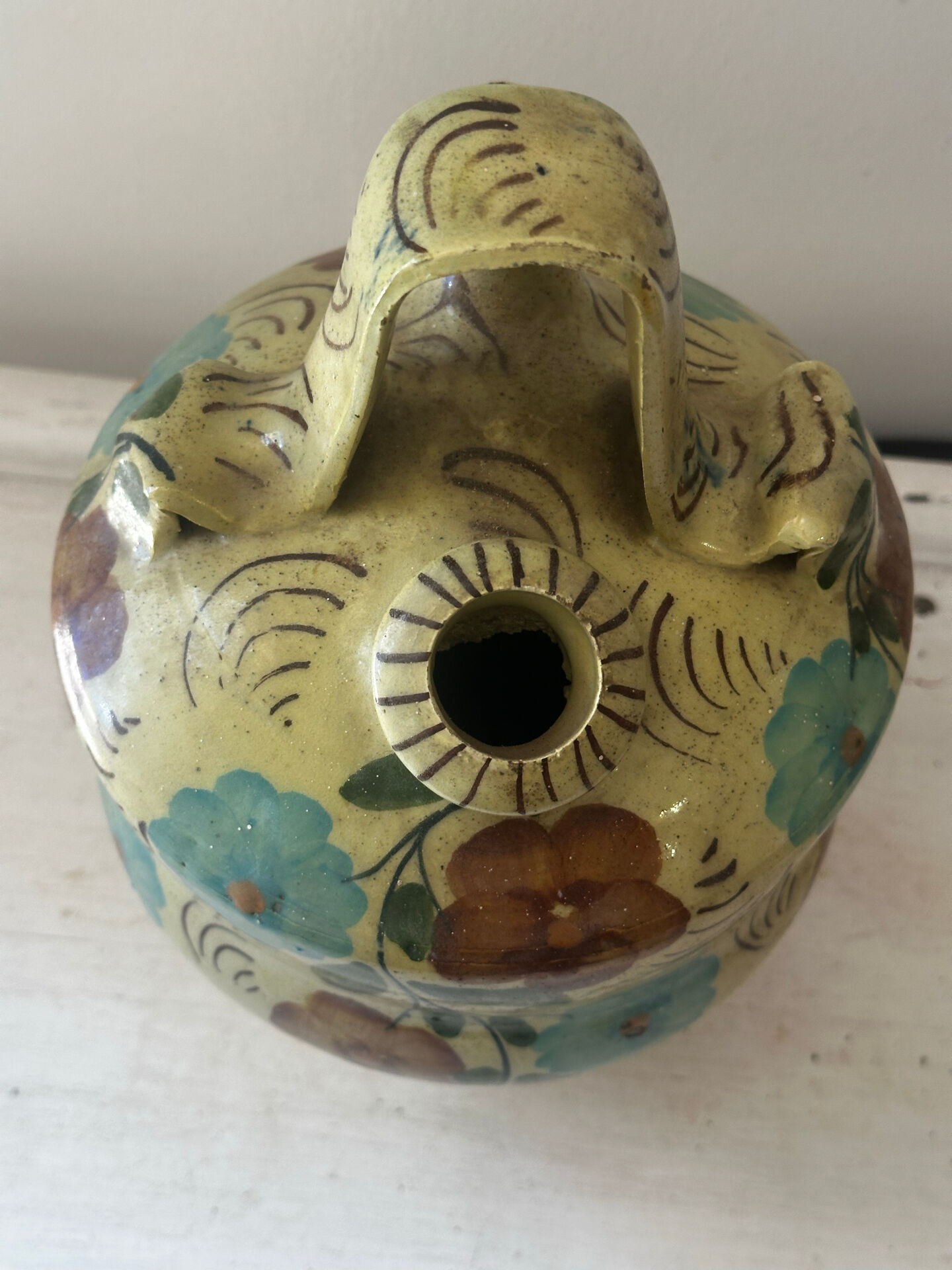 Mediterranean ceramic jug with floral decoration.