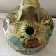 Mediterranean ceramic jug with floral decoration.