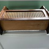 Wooden and cane newspaper rack