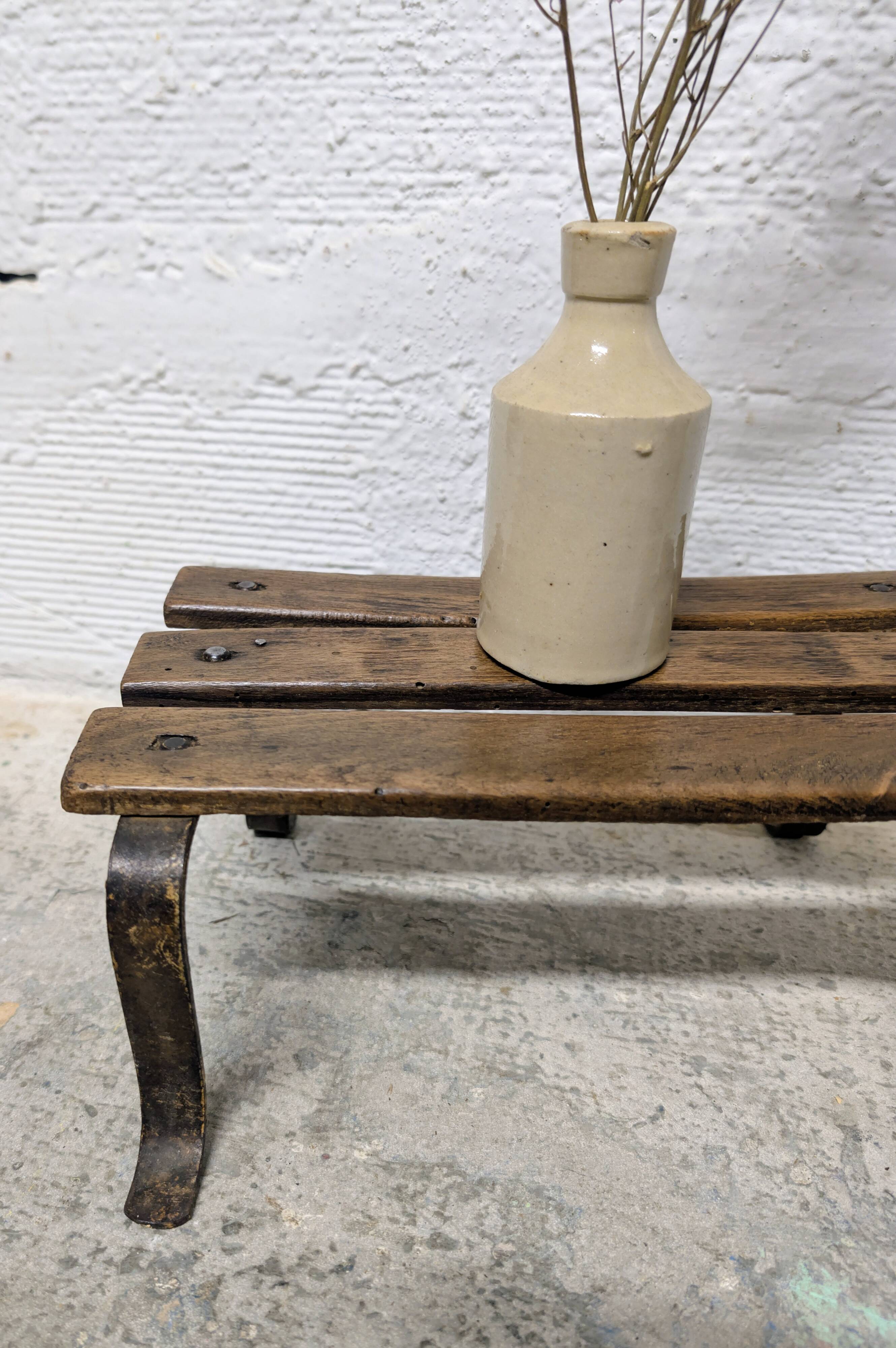 Antique iron and wood footrest