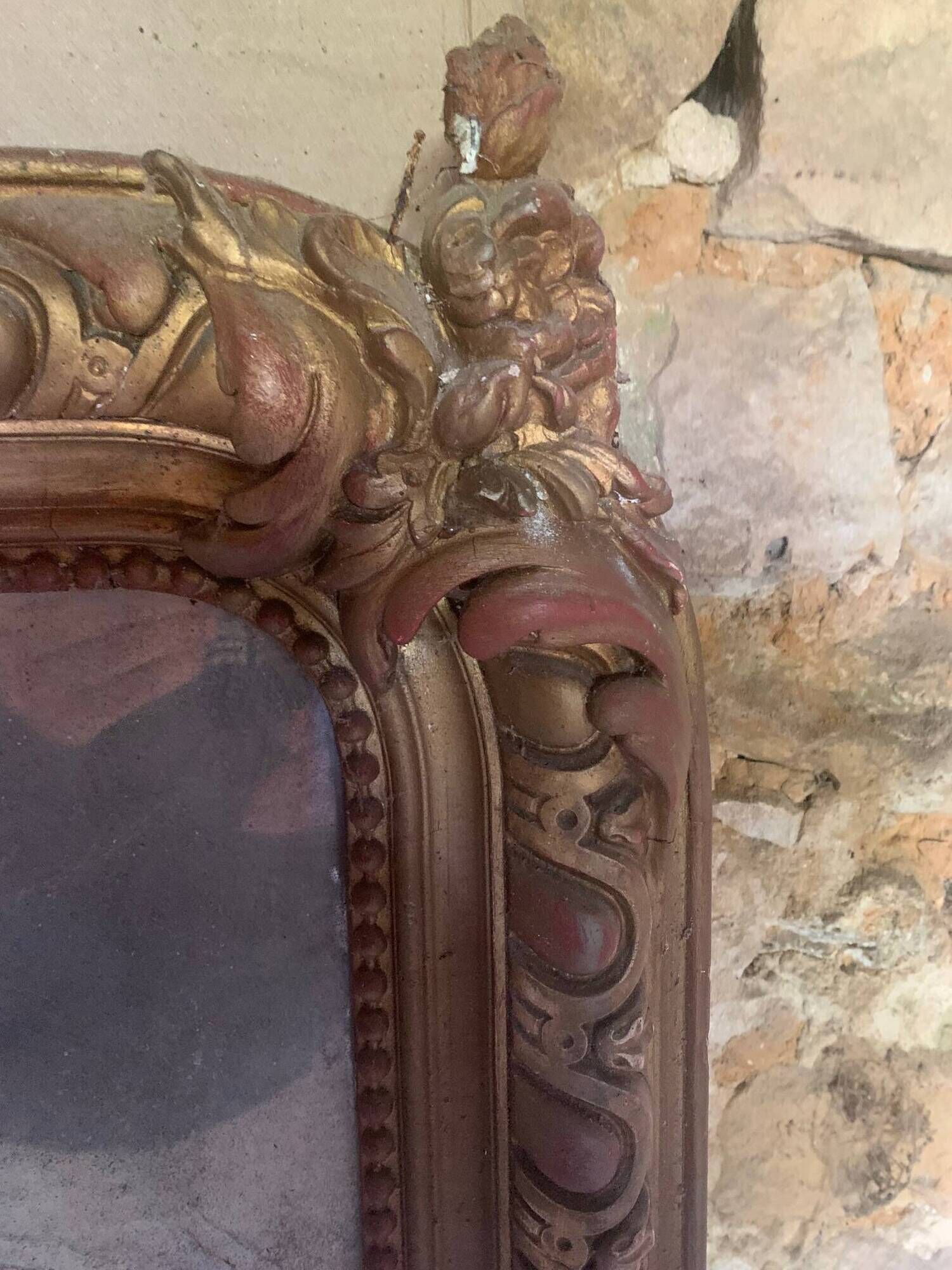 Large antique mirror in wood and gilded stucco.