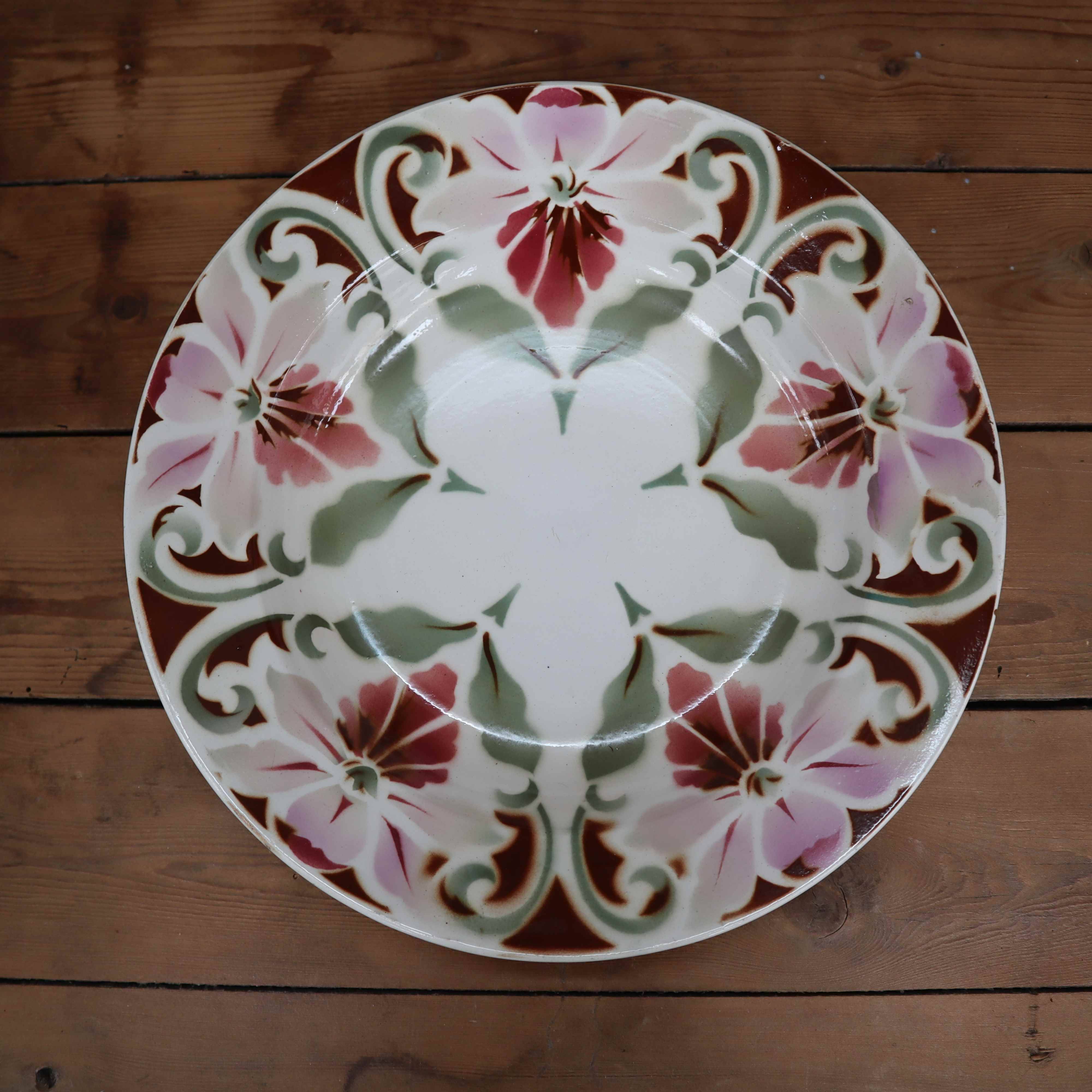 Old hollow earthenware dish with floral decoration Saint Amand