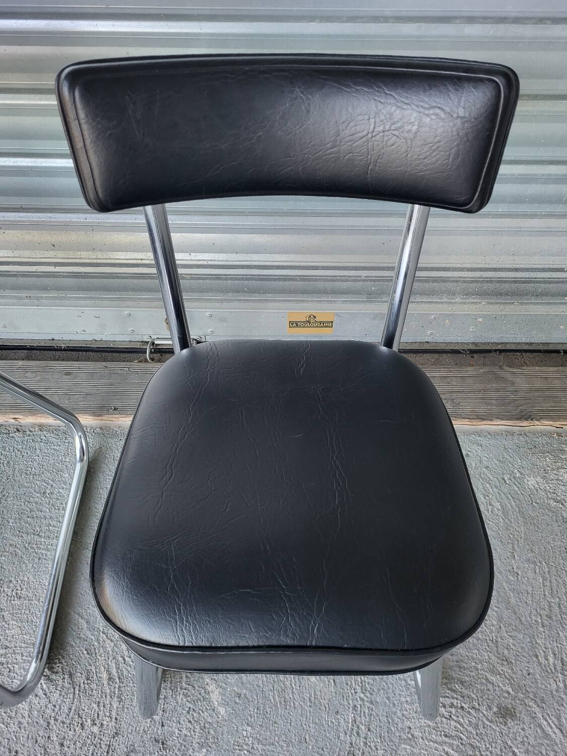 Pair of vintage black and chrome leatherette office chairs in very good condition