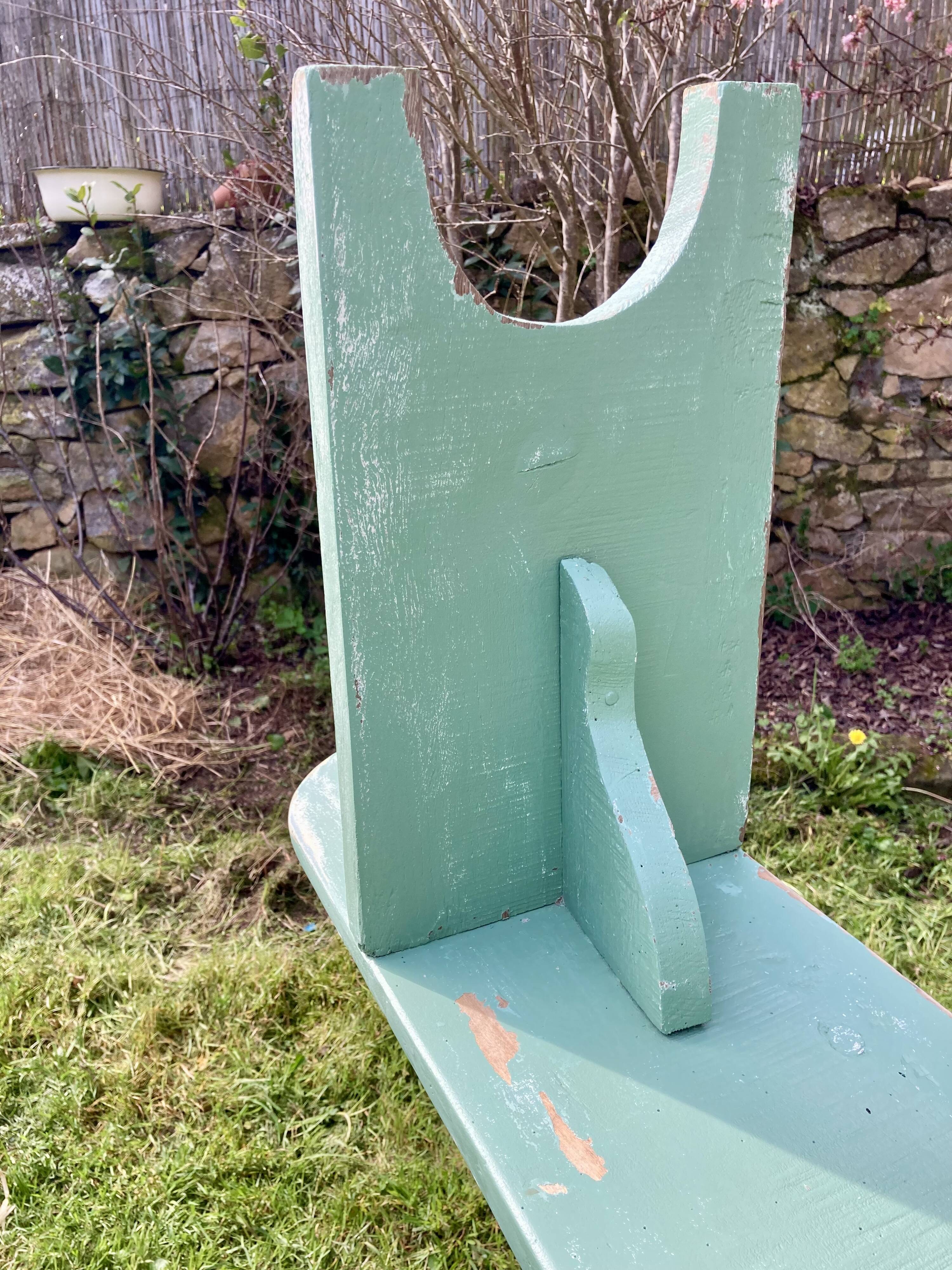 Old curved wooden farm bench