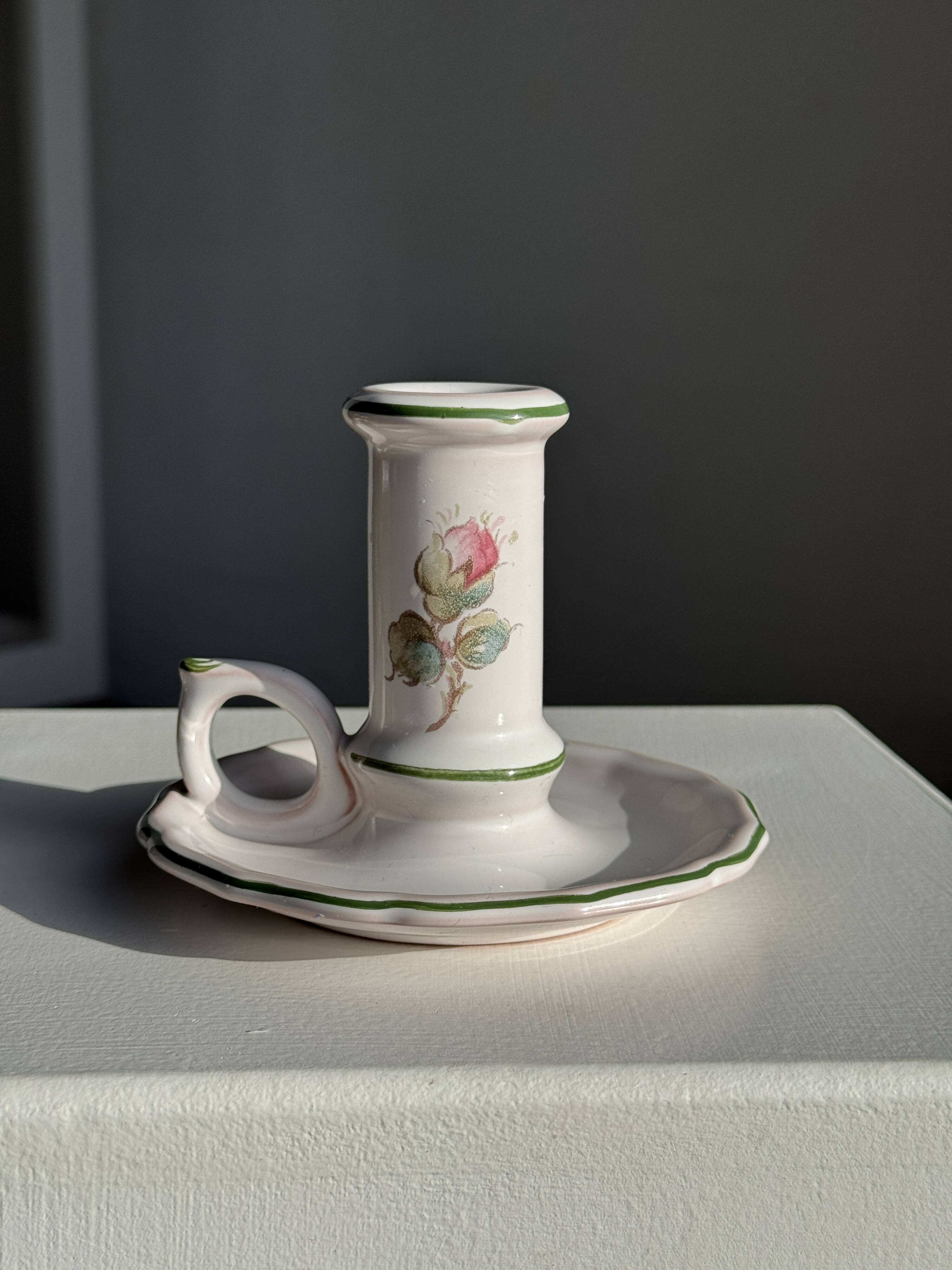 Small vintage hand-held candlestick in earthenware with green trim and floral decoration H10.5