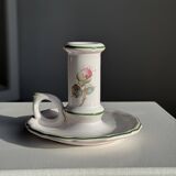 Small vintage hand-held candlestick in earthenware with green trim and floral decoration H10.5