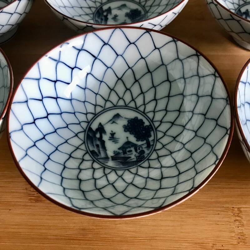 6 white and blue japanese porcelain bowls with mountain decoration