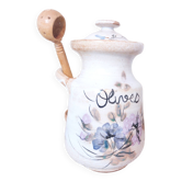 Old large vintage stoneware olive pot with its wooden spoon