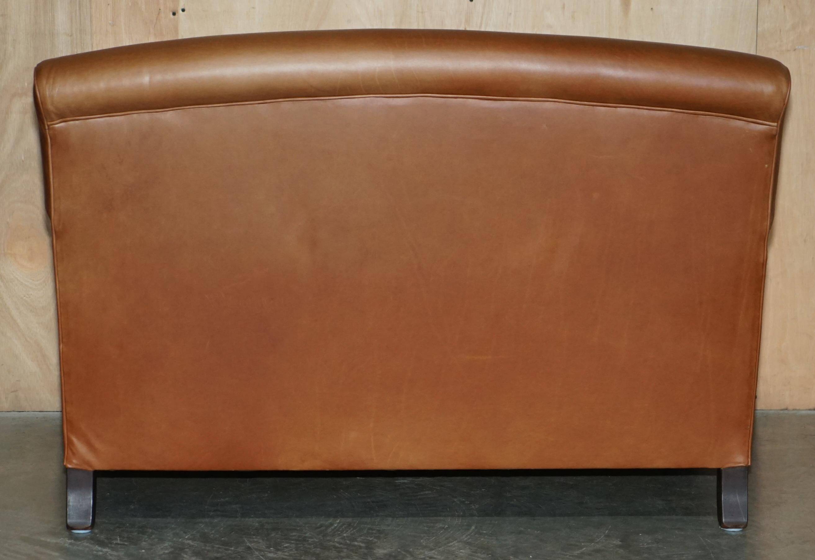 Two-seater leather armchair in Howard style by George Smith.