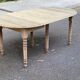 Round extendable dining table with flaps, stripped in raw oak, with 3 extensions.
