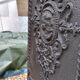 Black cast iron wood burning stove with solid brass handle.
