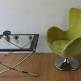 Bucket seat in chrome and green.