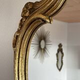 Old baroque style wall mirror with golden moldings