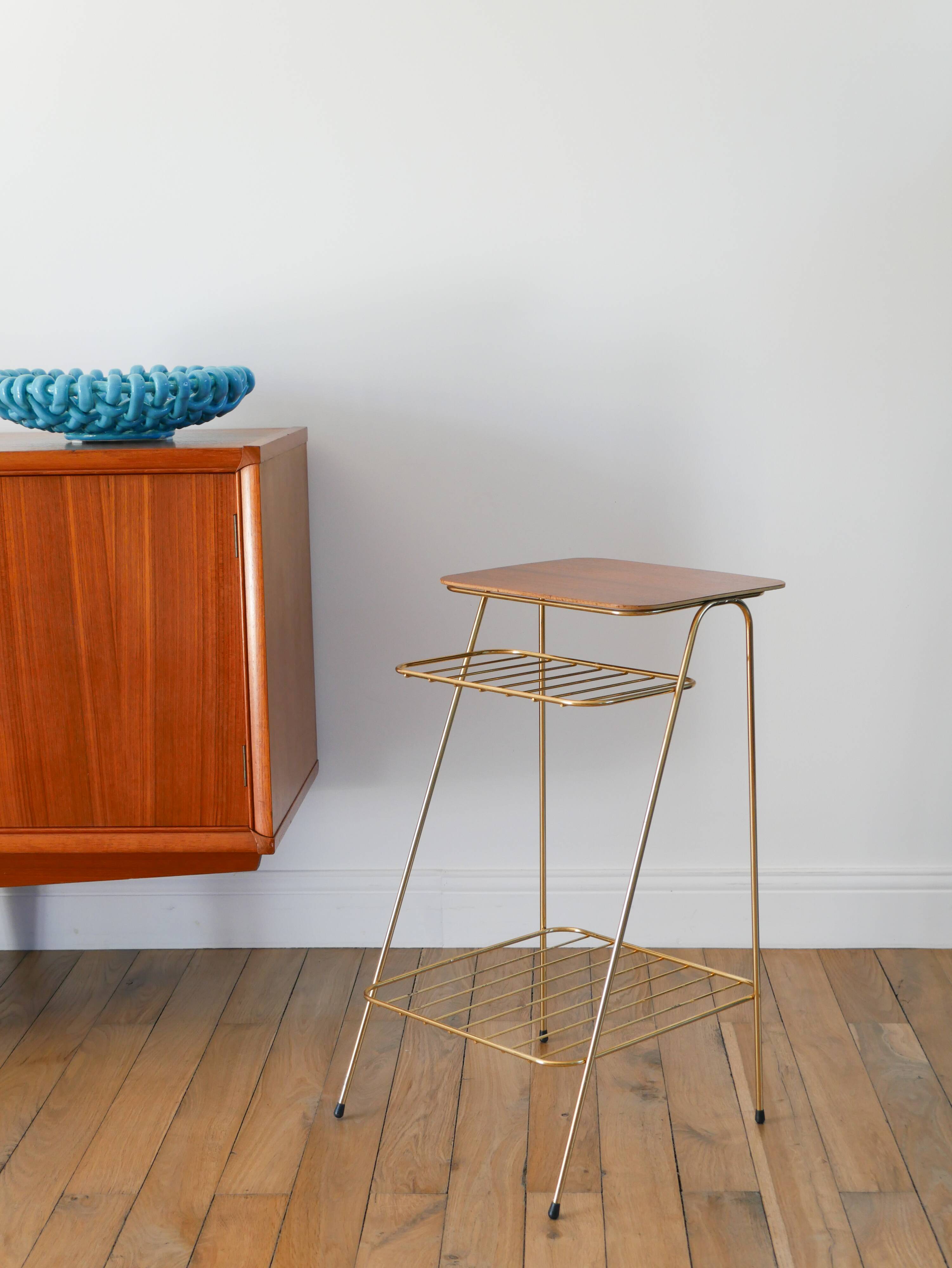 Small brass side table with a teak top, 1960.