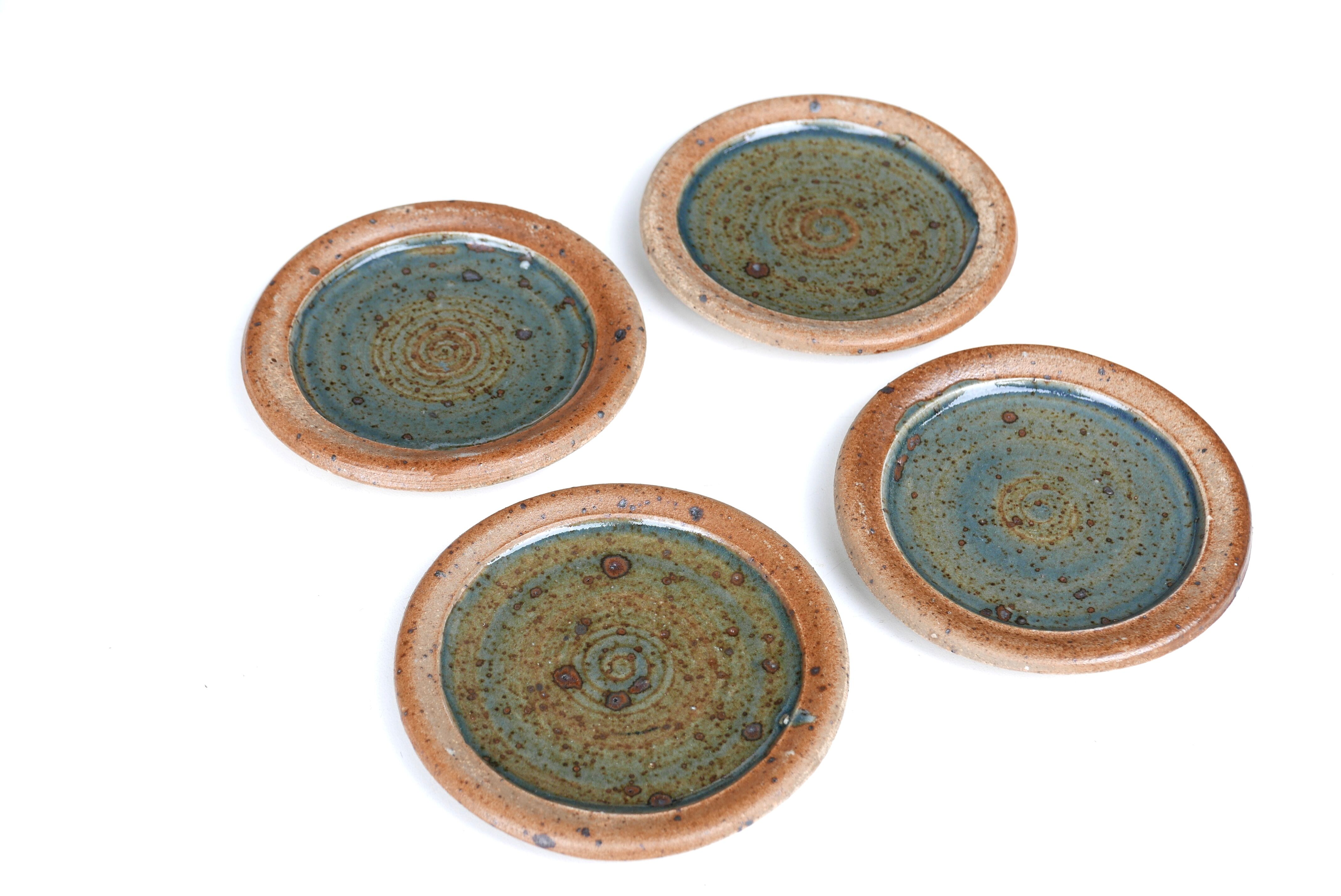 Set of 4 sandstone plates by Pierre Digan, 60s