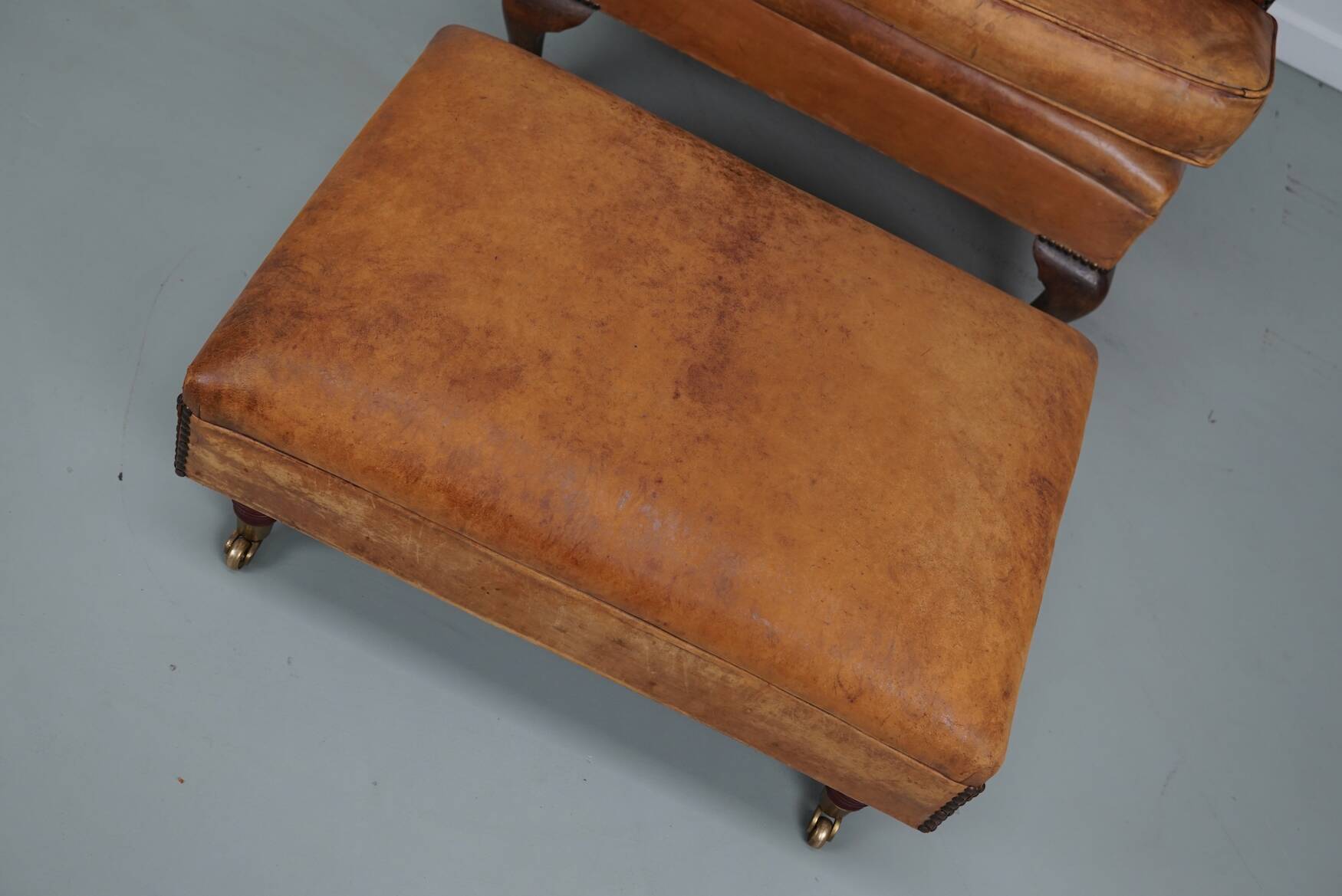 Vintage Dutch cognac coloured leather club chair, with footstool