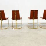 Set of four leather and brass Italian dining chairs