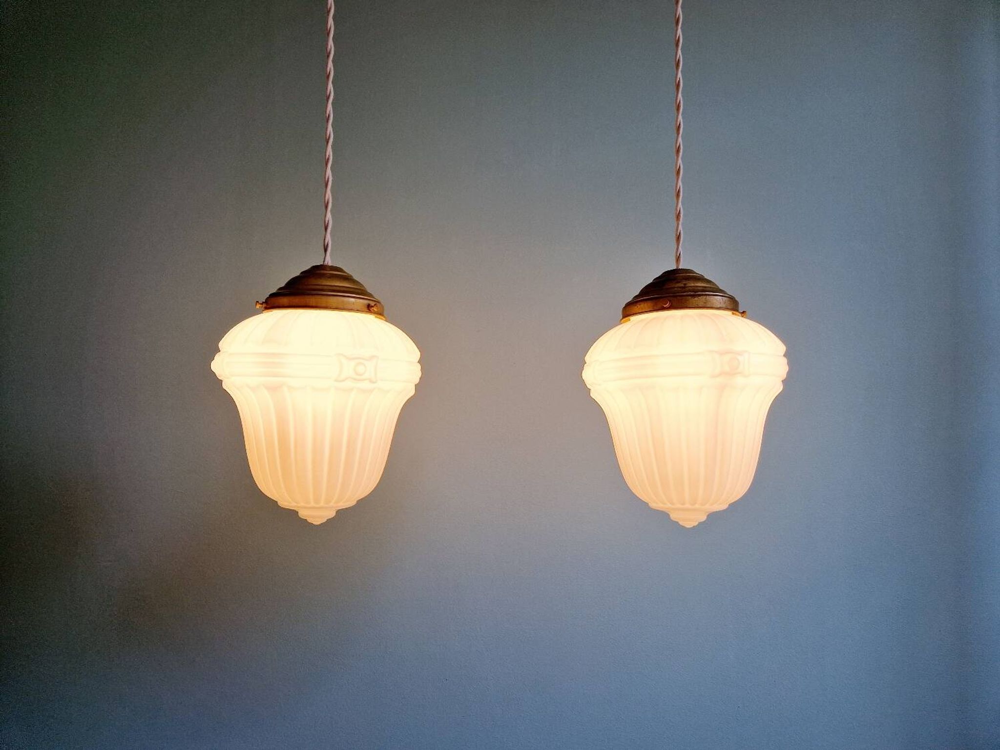 Pair of Art Deco pendant lights in pressed white opaline glass, 1920-30