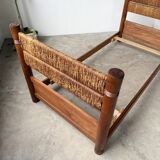 Brutalist style bed with chain and straw