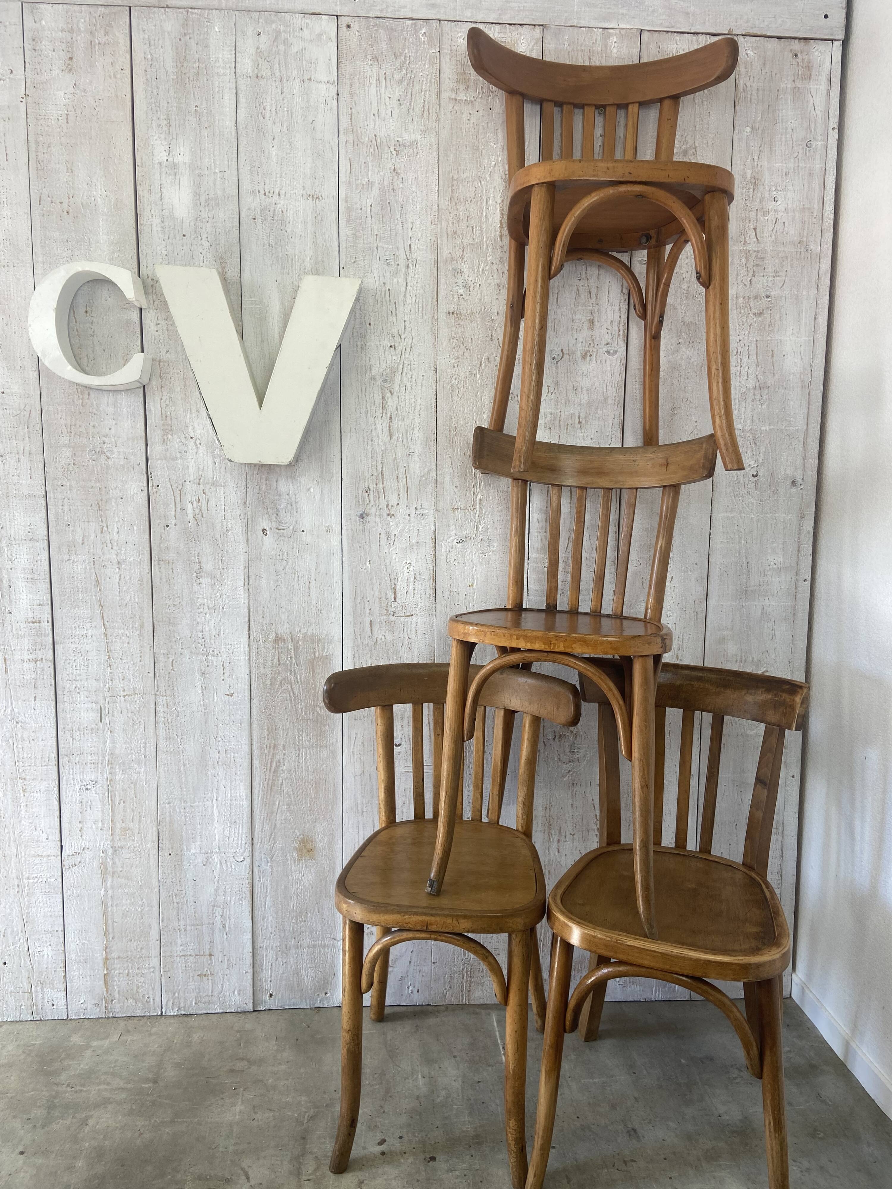 Mismatched curved wood bistro chairs (Fischel..)