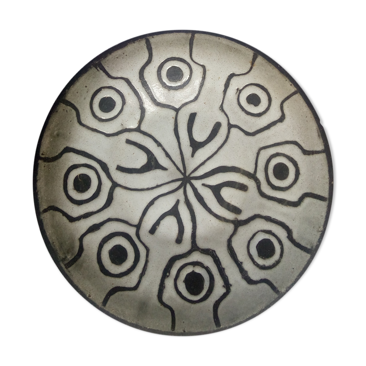 Large black and white brutalist dish