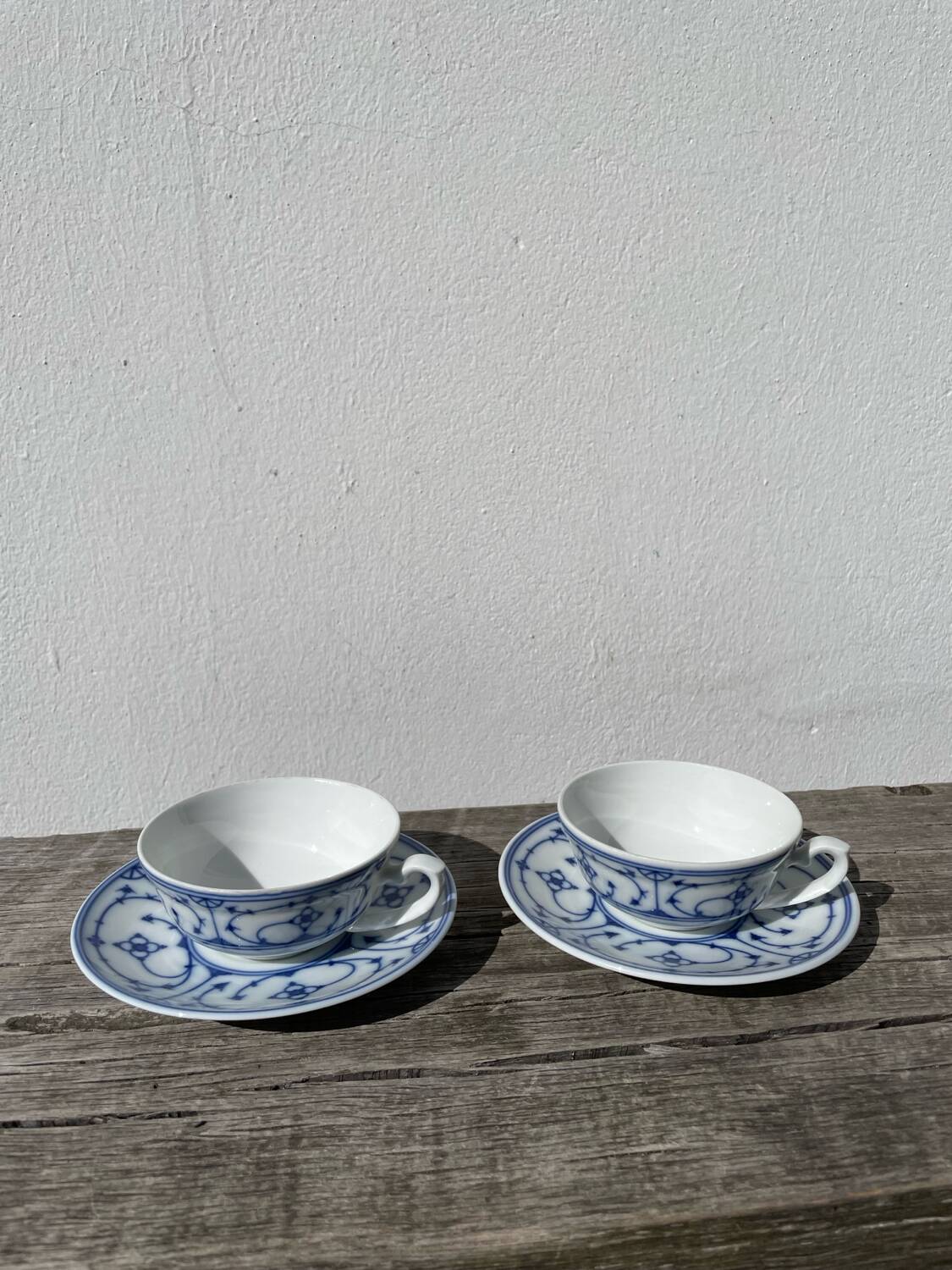 Pair of signed blue porcelain cups