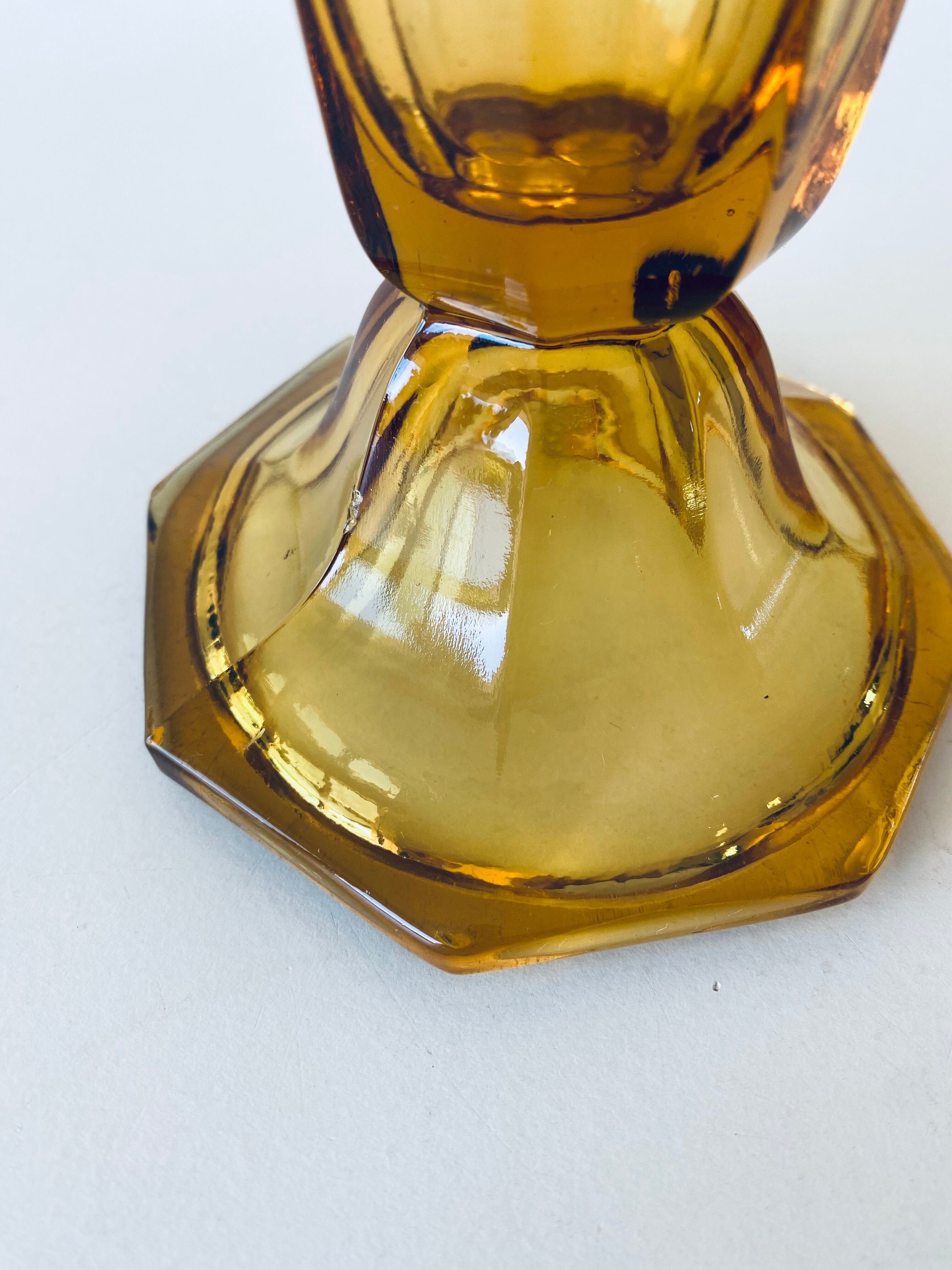 Ancient tulip vase in amber glass