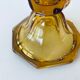 Ancient tulip vase in amber glass